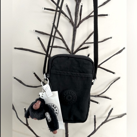 Kipling Handbags - Brand new “Kipling”mini crossbody bag for women.Size-w5”x7”inc.Color-black tonal